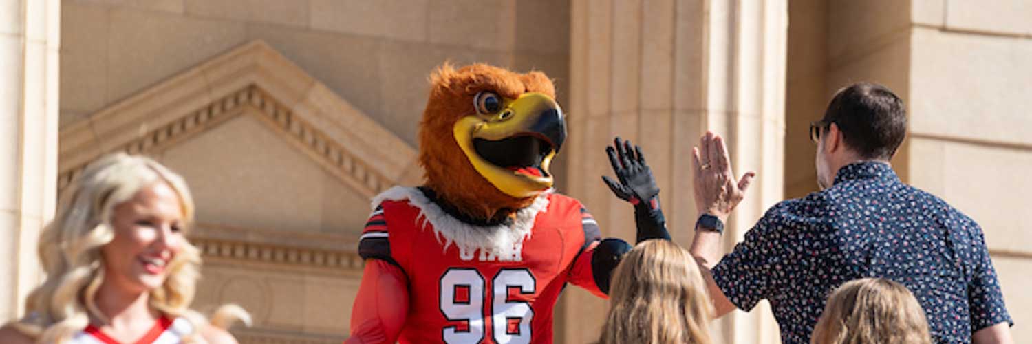 Swoop gives a student a high-five